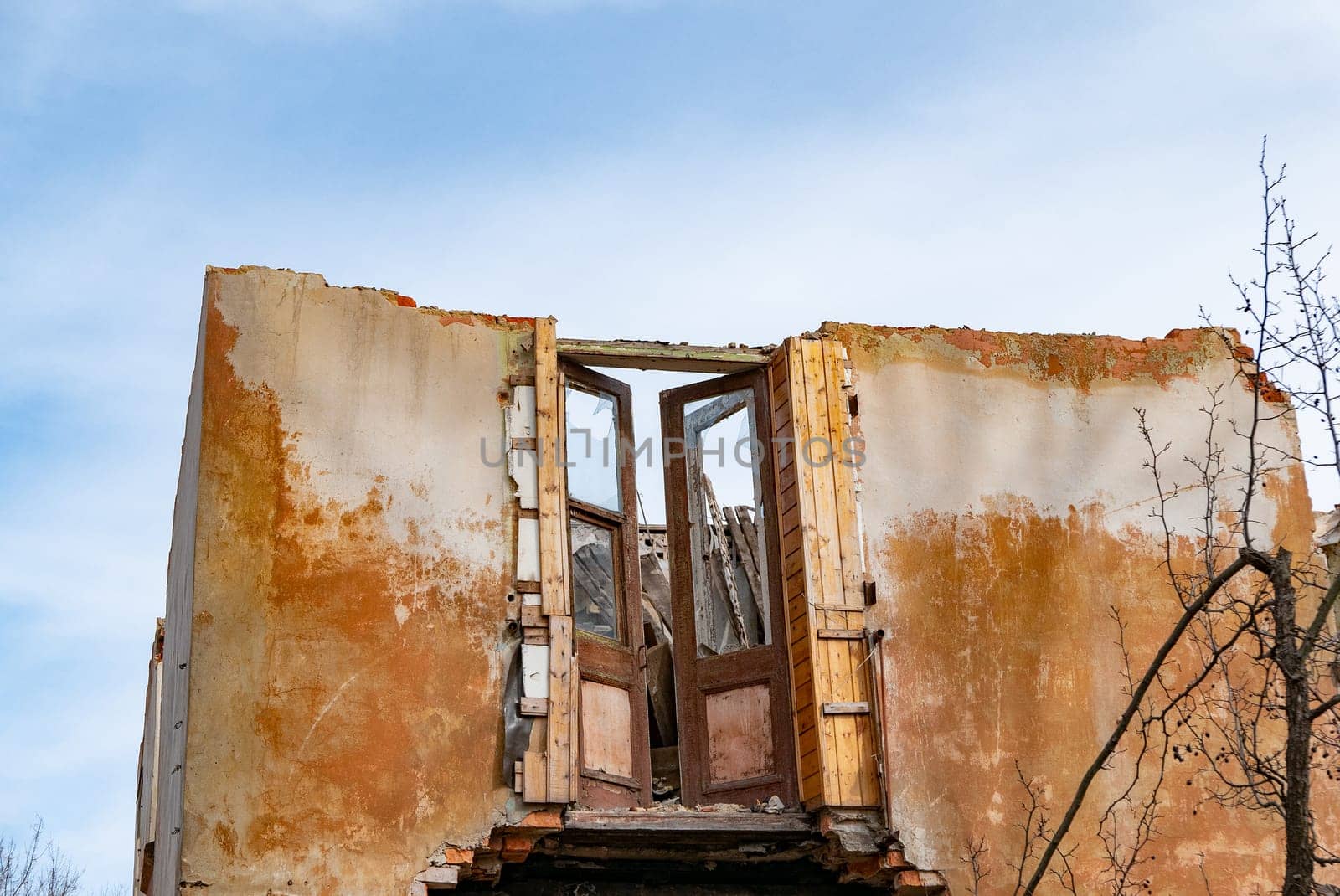 Post-war landscape. Destroyed building. War ruins. Destroyed city after the bombing. Dead city. Bombed buildings. Debris buildings. War destruction.