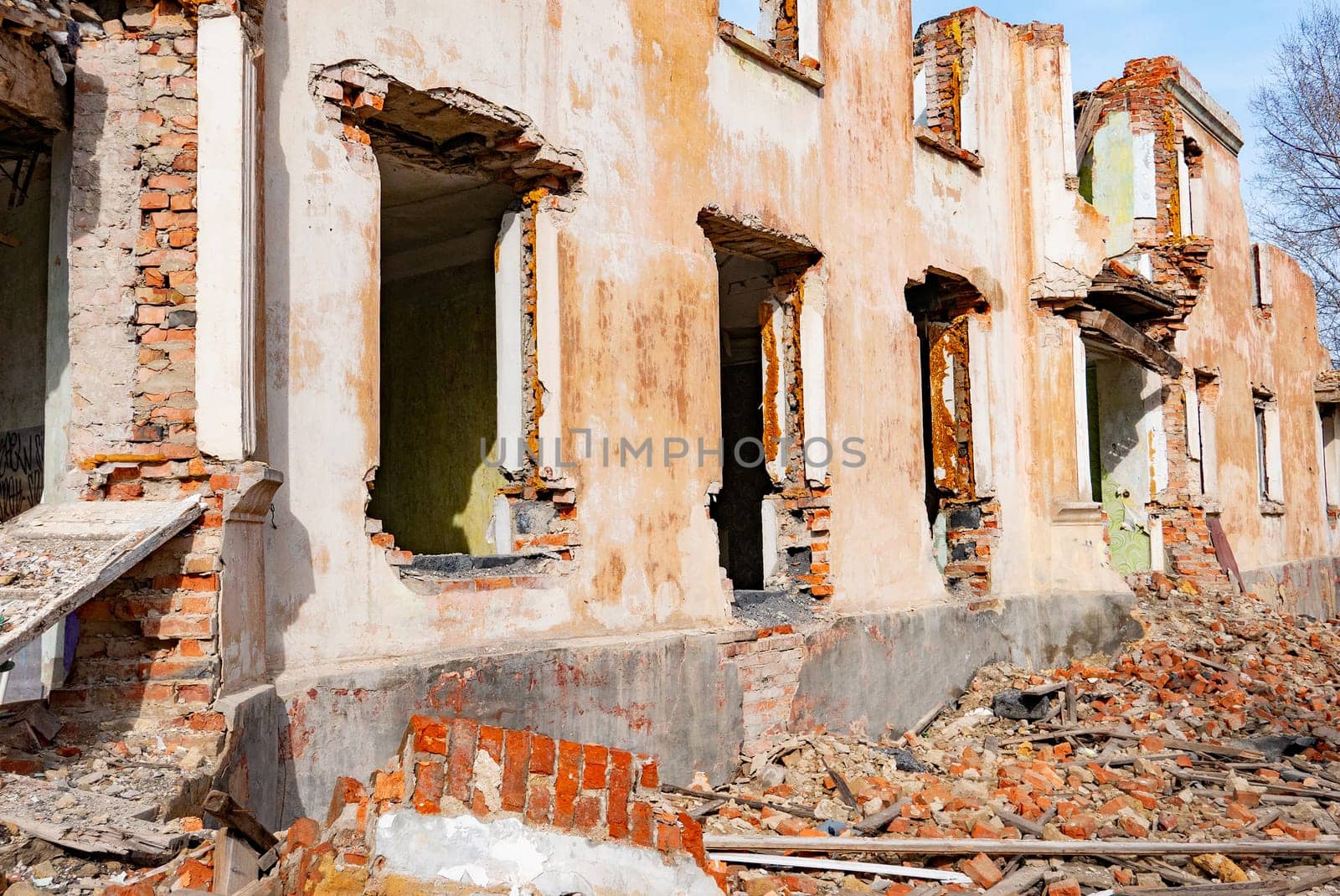 Post-war landscape. Destroyed building. War ruins. Destroyed city after the bombing. Dead city. Bombed buildings. Debris buildings. War destruction.