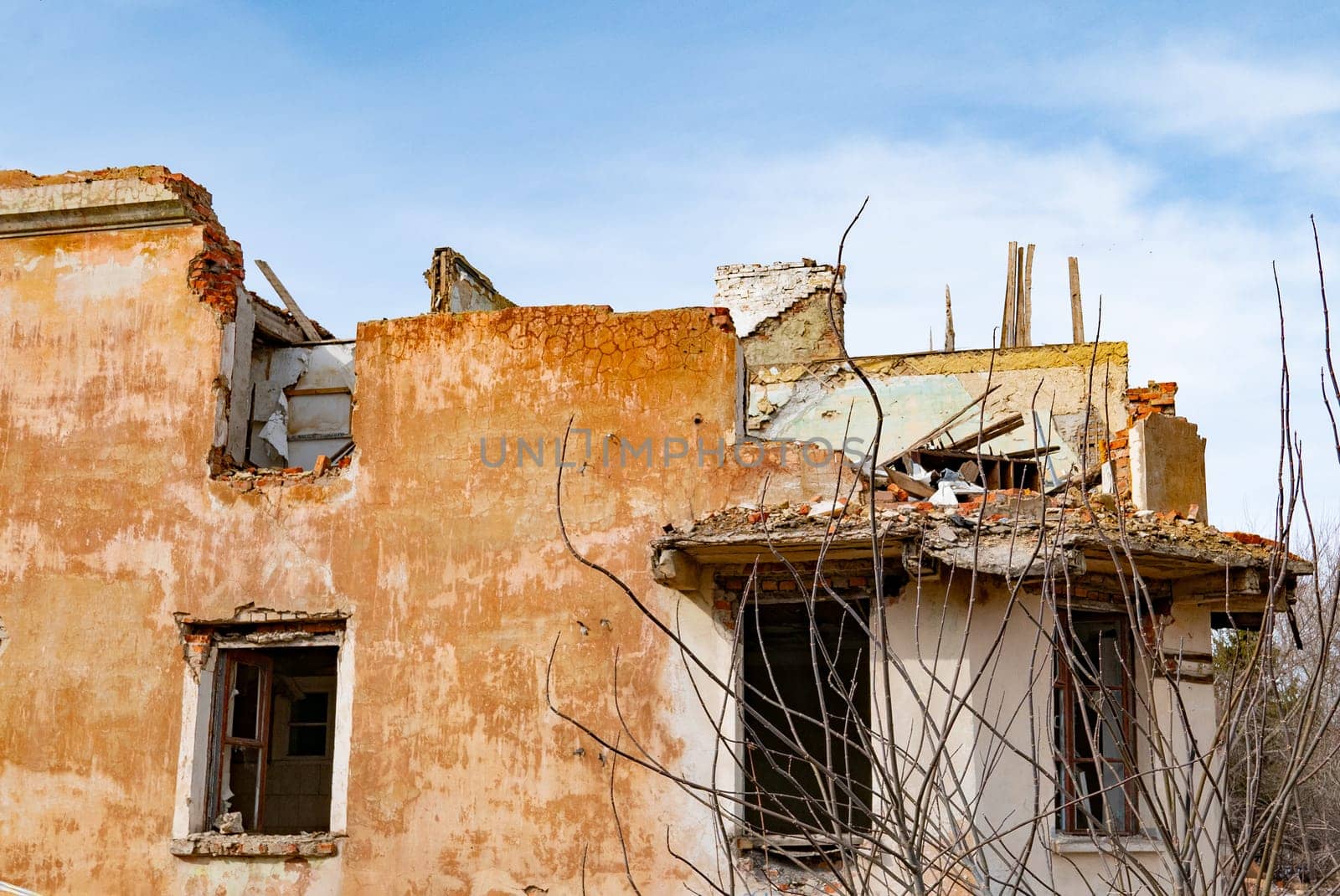 Post-war landscape. Destroyed building. War ruins. Destroyed city after the bombing. Dead city. Bombed buildings. Debris buildings. War destruction.