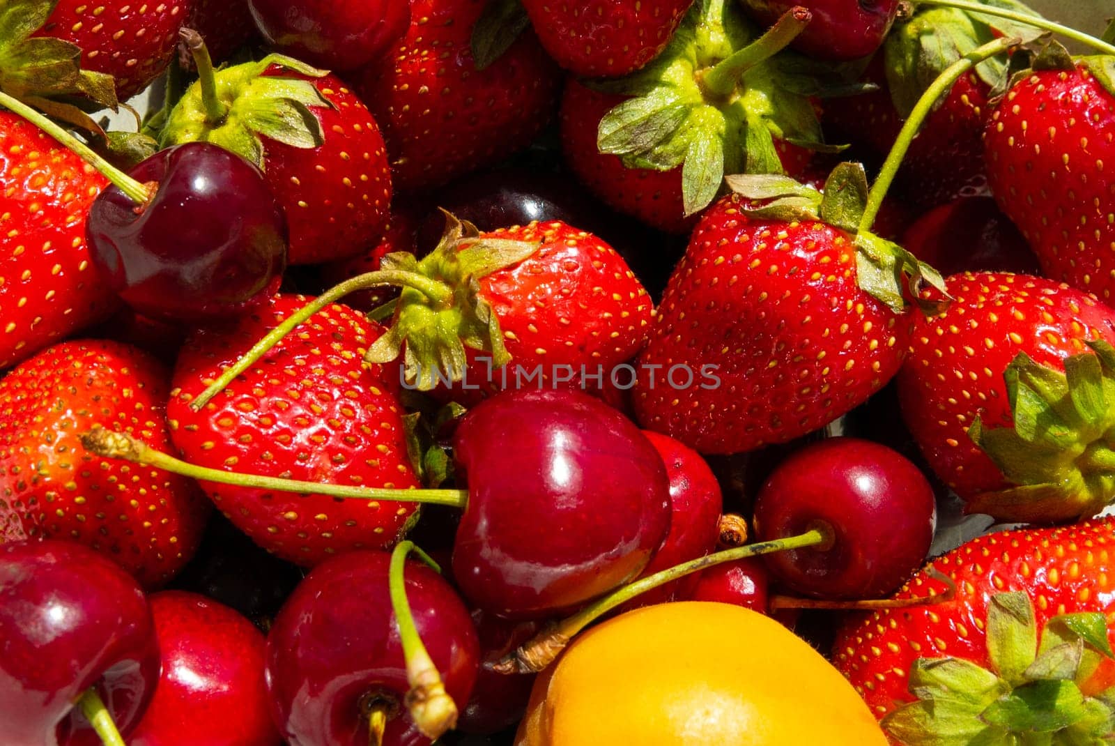 Ripe tasty berries apricot, sweet cherry, strawberry close up. Top view