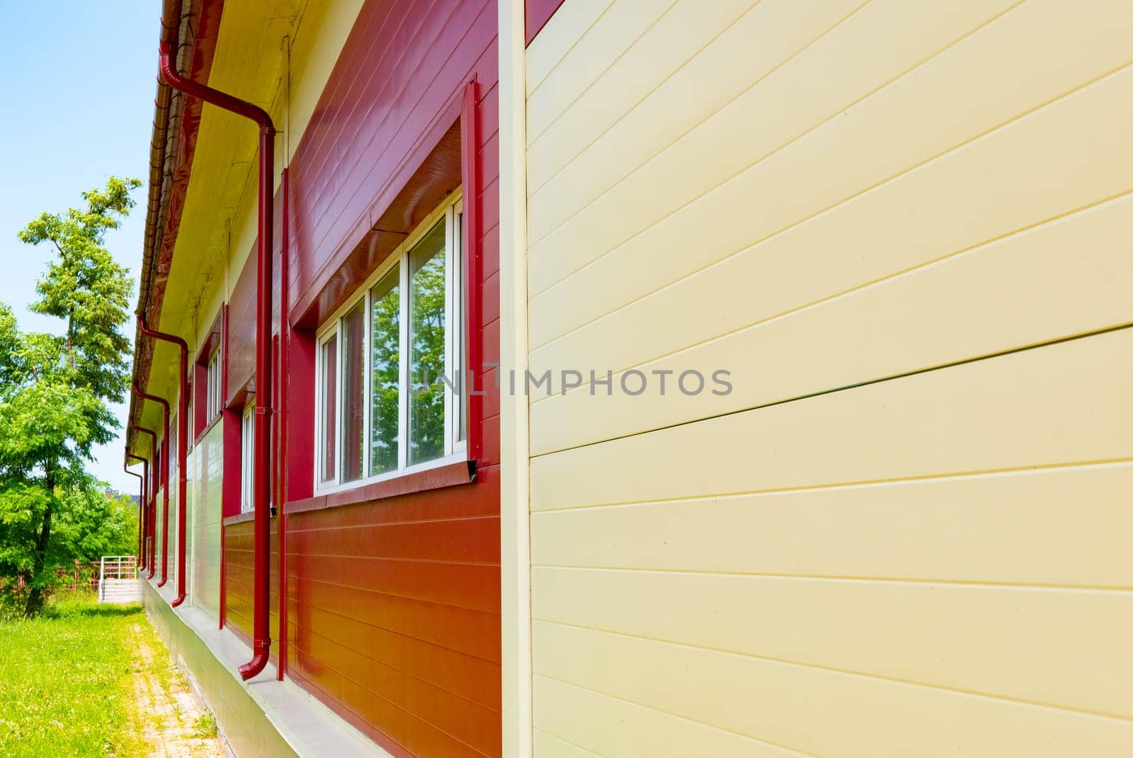 Red gutter on the roof top of house. by zartarn