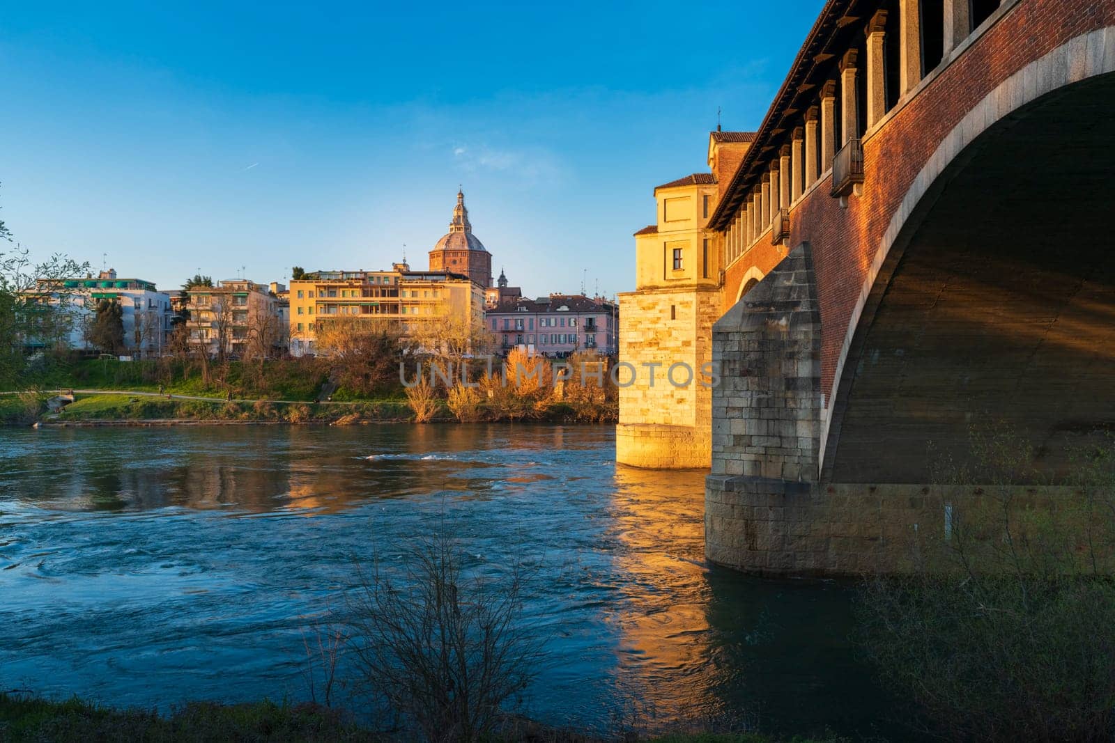 Panorama of covered bridge and Pavia cathedral at sunny day by Robertobinetti70