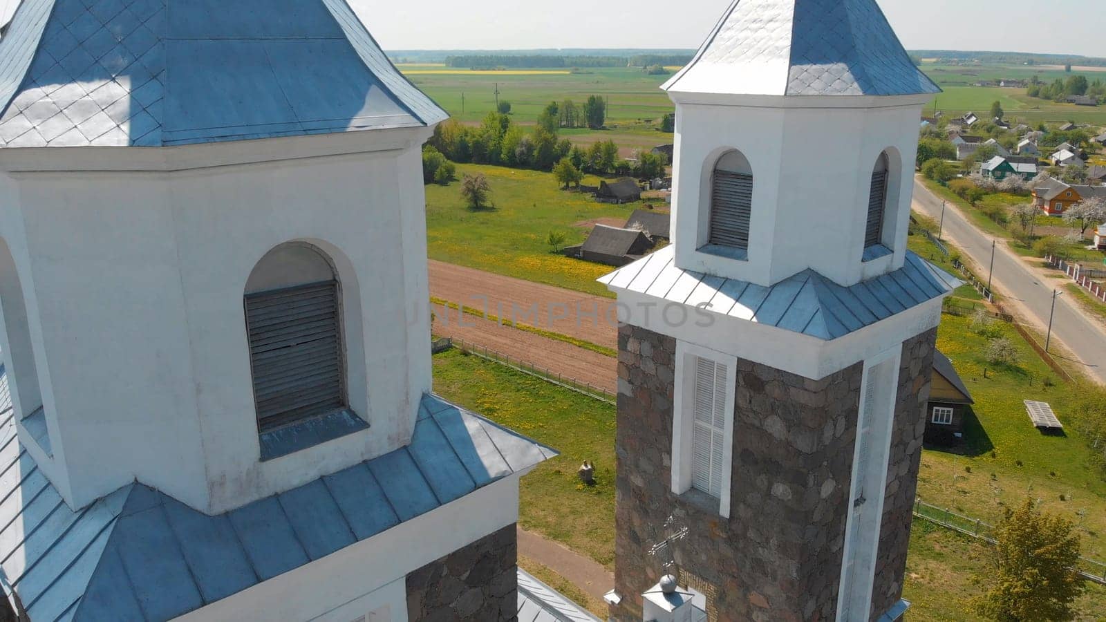 The Catholic Church of Our Lady of Ruzhantsova in the village of Radun. Belarus. Aerial view. by DovidPro