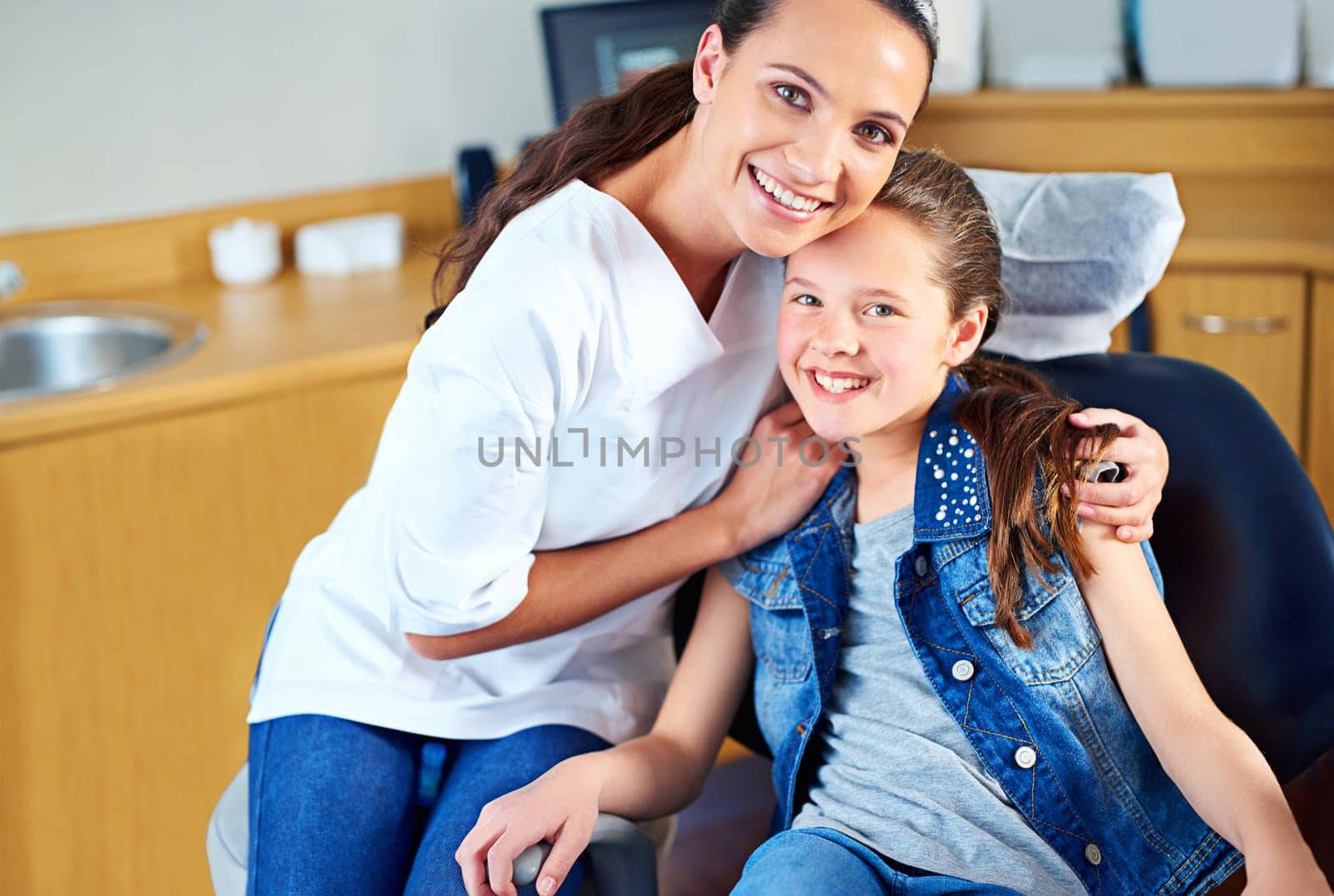 Portrait, girl and dentist with child, woman and consultation for medical procedure and oral health. Face, professional and kid with employee and dental hygiene with care and trust with appointment by YuriArcurs
