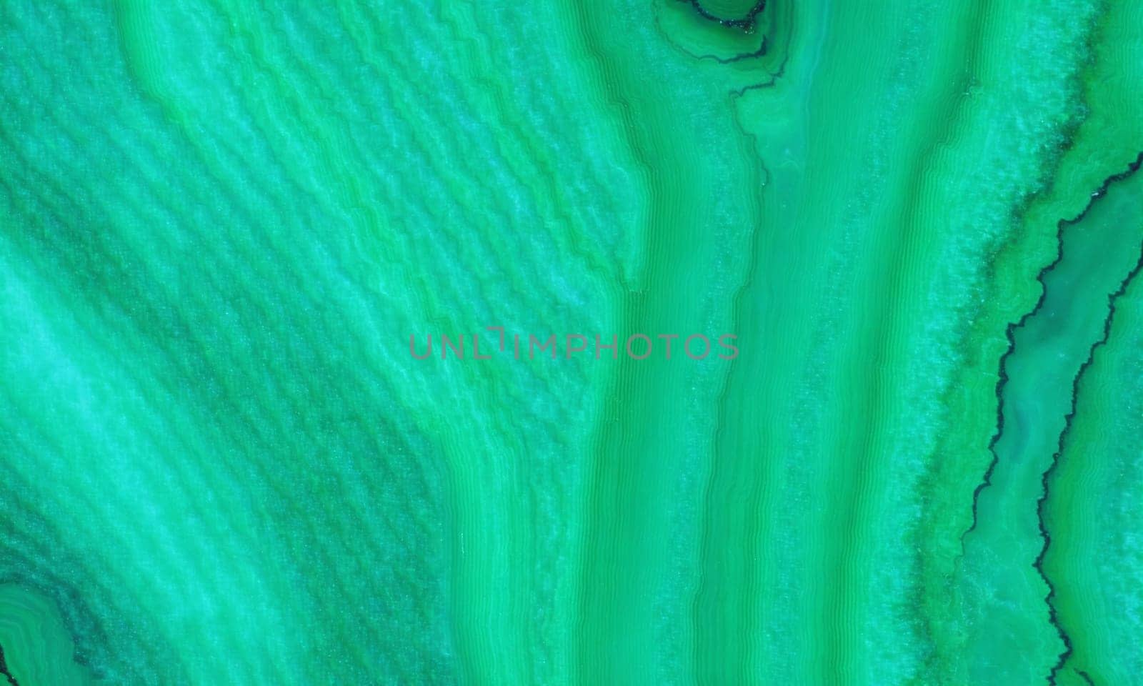 malachite. Emerald green natural stone texture background. Close up of emerald gemstone by Andre1ns