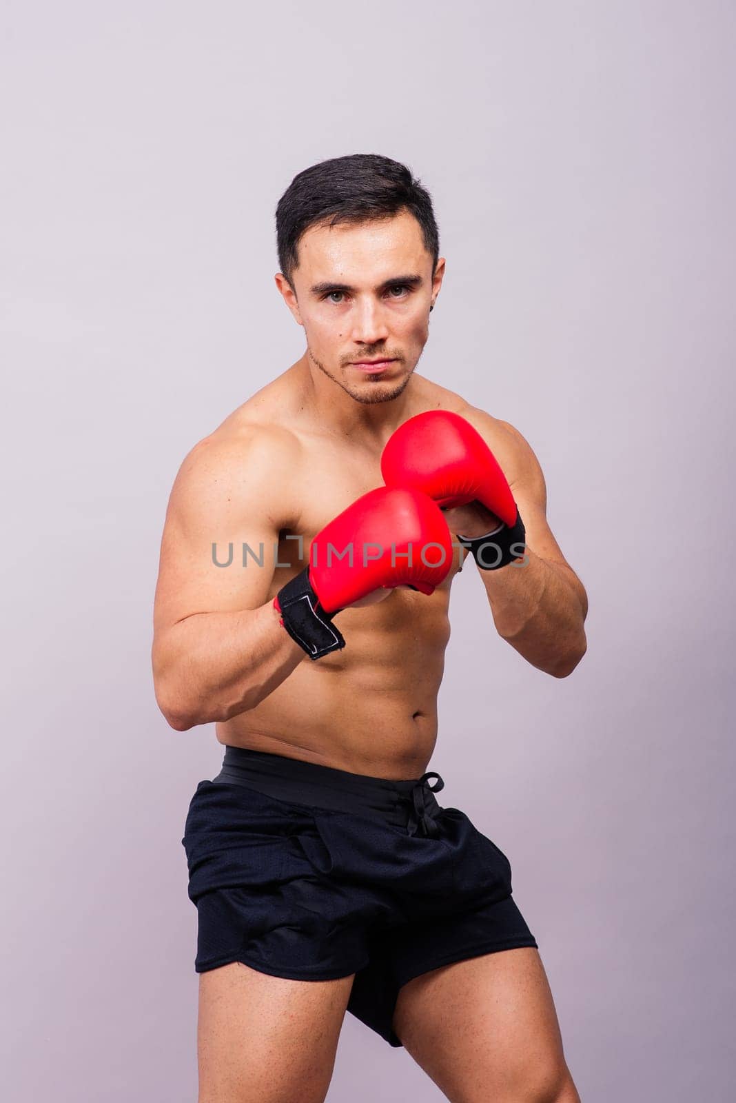 Training, young man and boxer with boxing gloves for competition, prepare for match by Zelenin