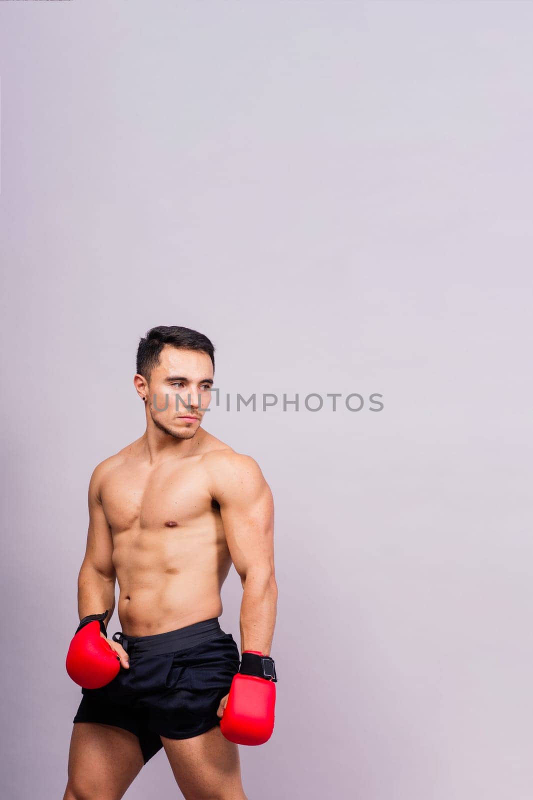 Training, young man and boxer with boxing gloves for competition, prepare for match by Zelenin