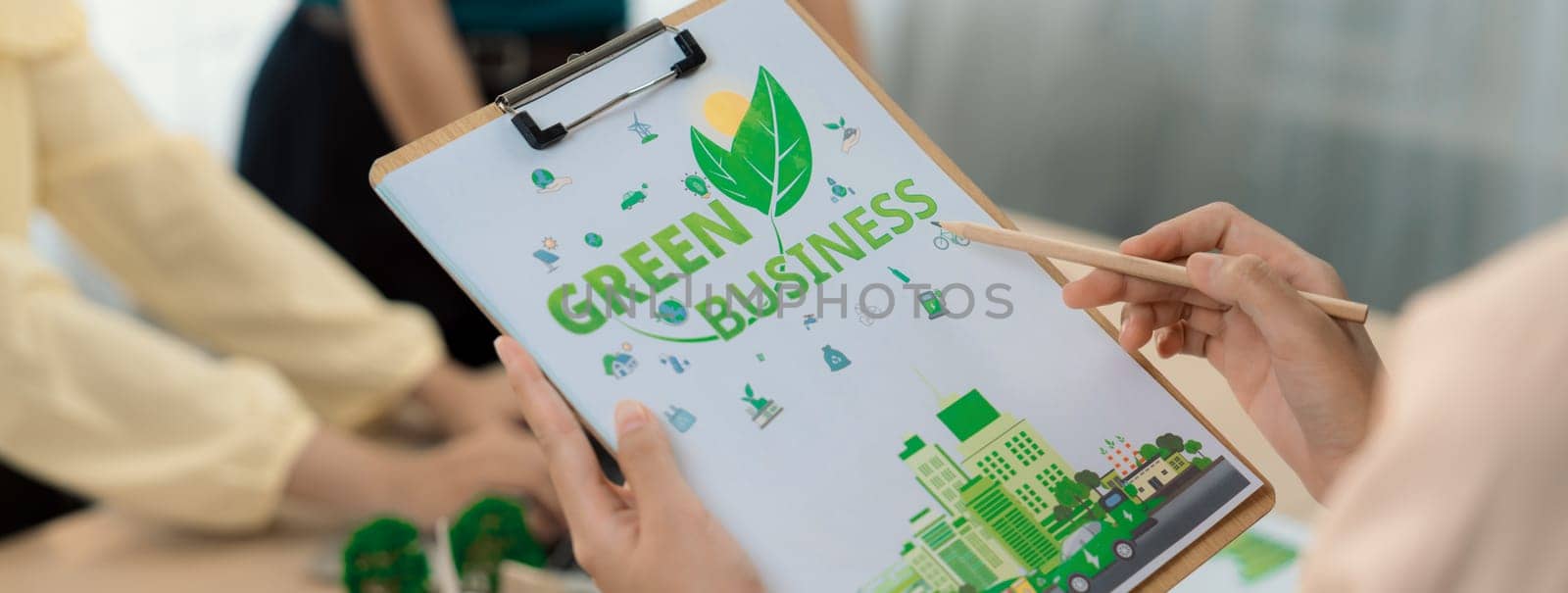 Green business project was presented by green business team at meeting room. ESG environment social governance and Eco conservative concept. Blurring background. Closeup. Delineation.