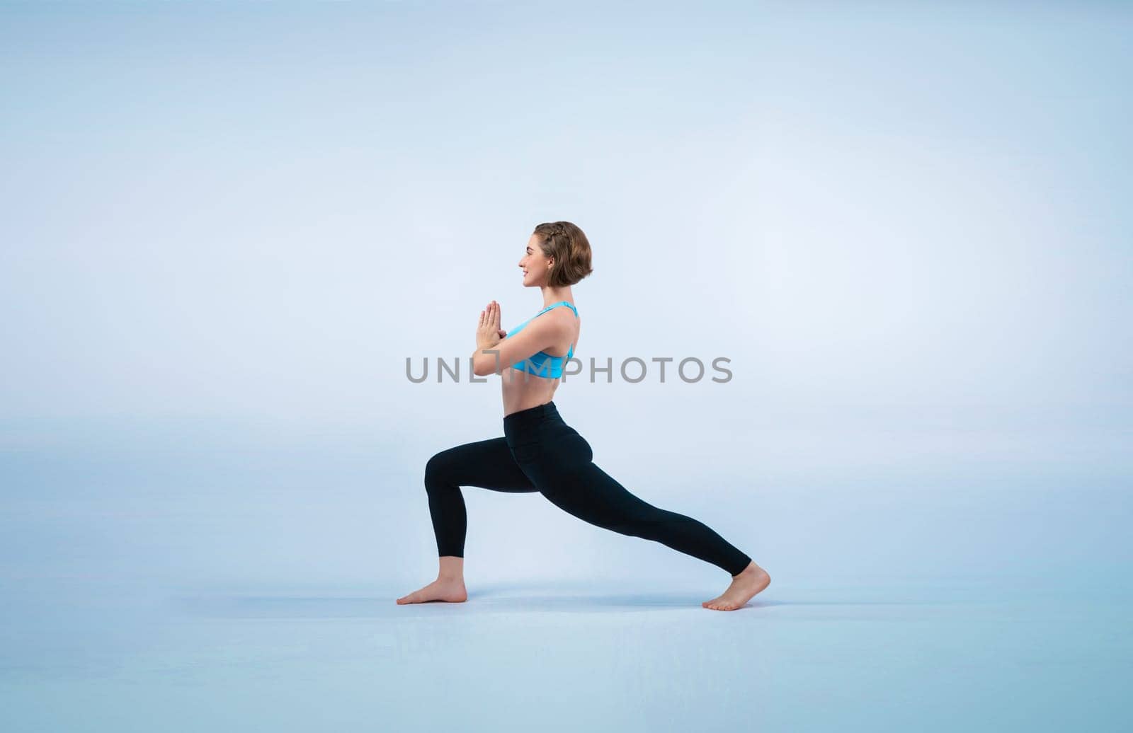 Full body length gaiety shot athletic and sporty woman doing healthy and meditative yoga exercise workout posture on isolated background. Healthy active and body care lifestyle