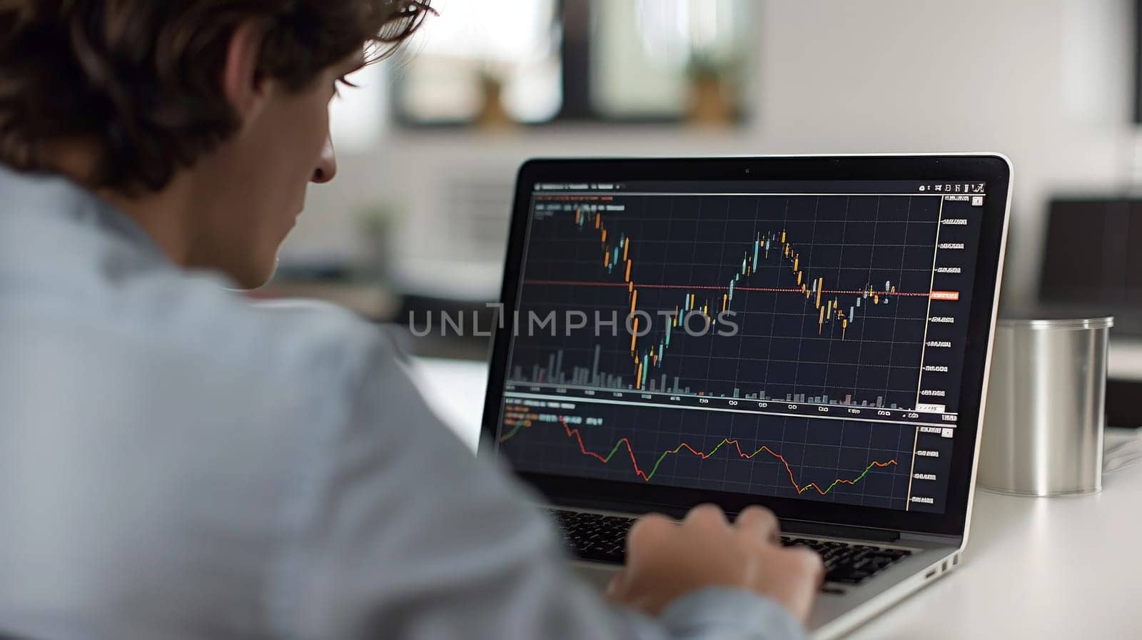 A close up photo of a young investor studying stock options on a laptop by nijieimu
