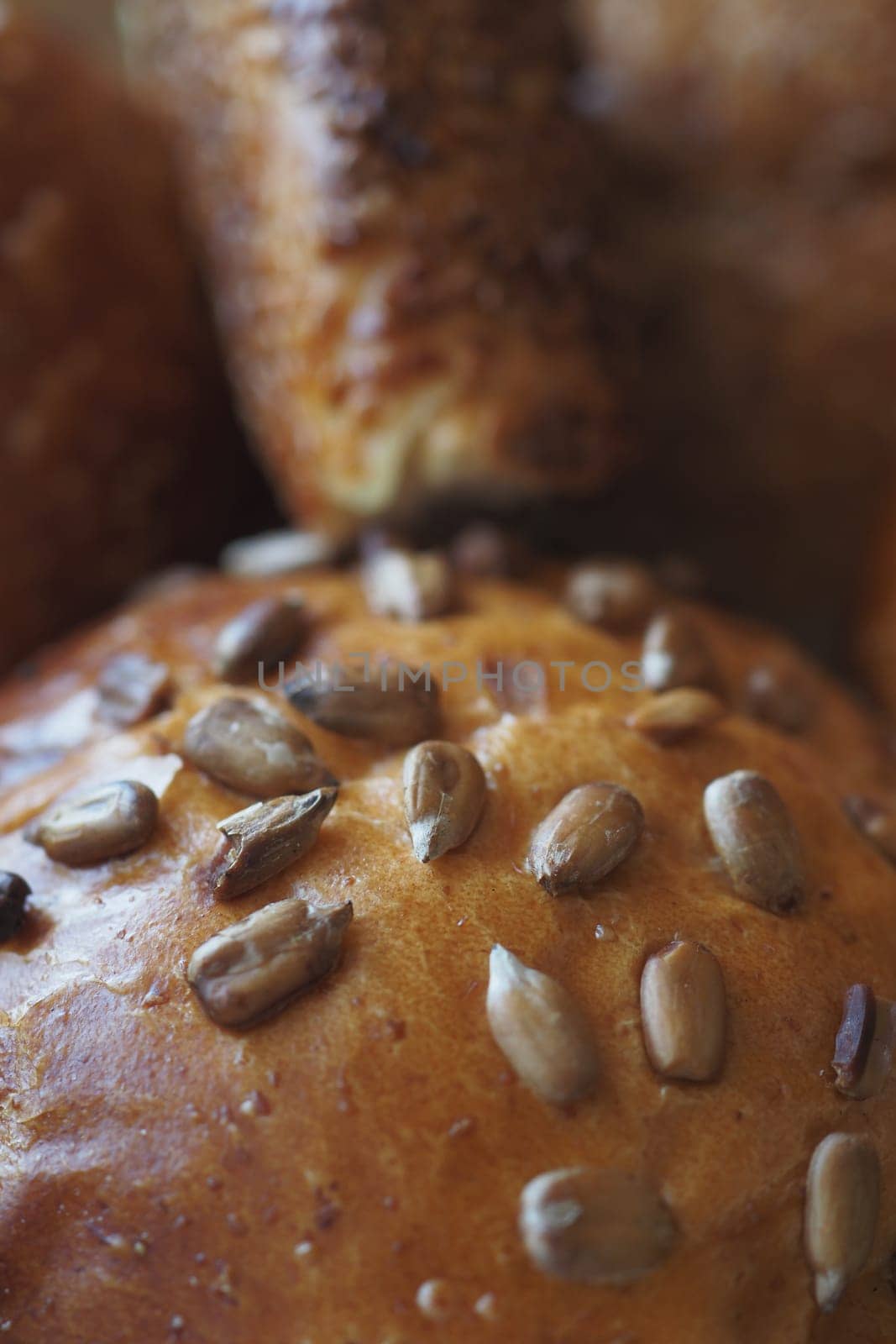detail shot of sunflower seed baked bread on table .