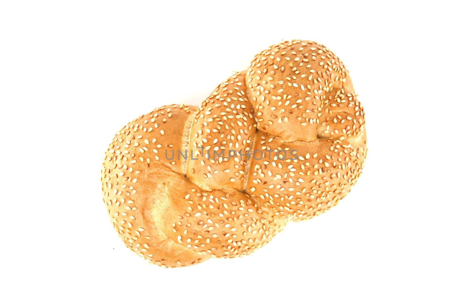 Golden braided sesame bread isolated on white background