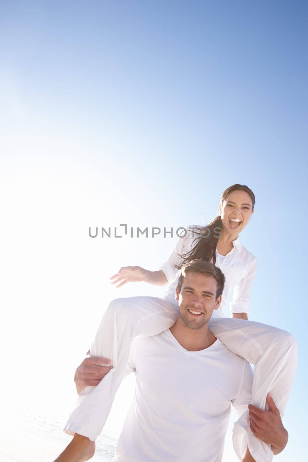 Man carrying woman, couple and outdoor with love, marriage and excited with vacation and bonding together. Portrait, park and people with fun and cheerful with romance and relationship with holiday.