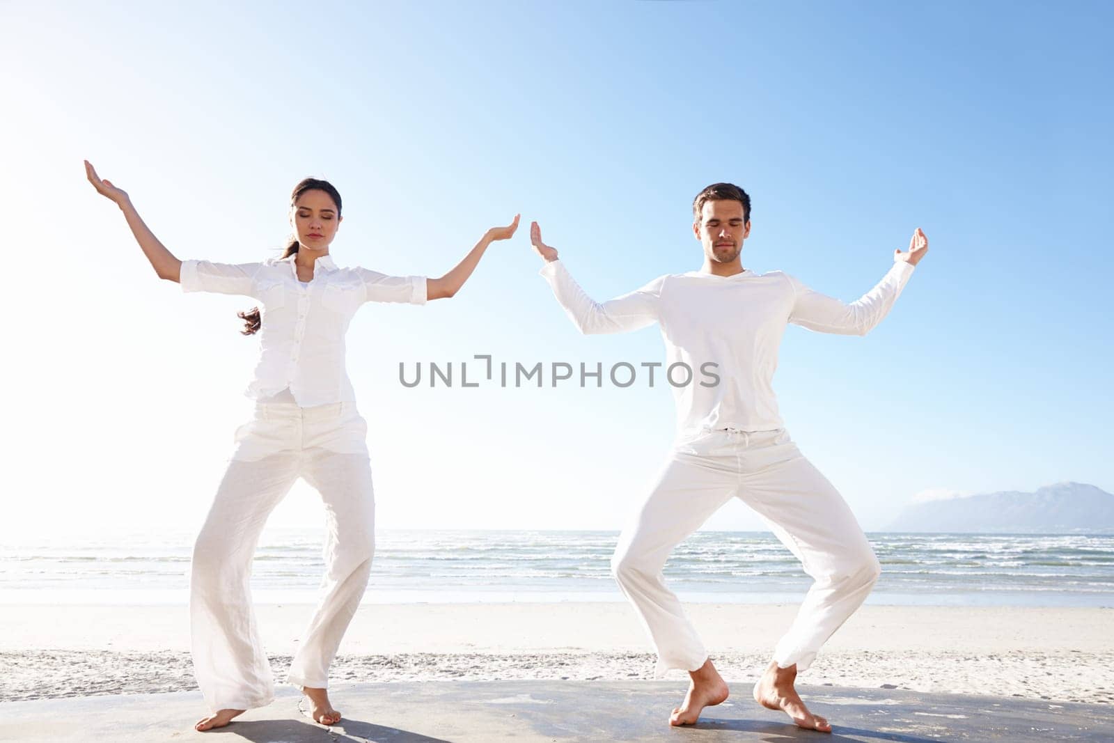 Couple, yoga or beach in mindfulness, practice of meditation as health, fitness or wellness in peace. Man, woman or eyes closed to focus as spiritual, zen or performance for balance and gratitude.