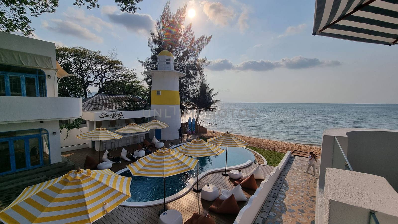 Bangsaray Pattaya Thailand 28 February 2024, A tranquil beach scene with colorful umbrellas and inviting chairs, creating a relaxing atmosphere on a sunny day.
