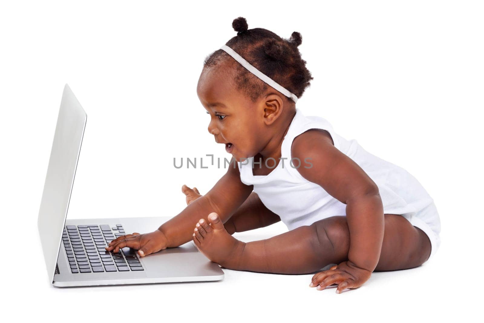 African baby in studio with laptop on white background for learning, development or growth or milestones with computer. Girl, backdrop or technology, curious or childhood education or formation.