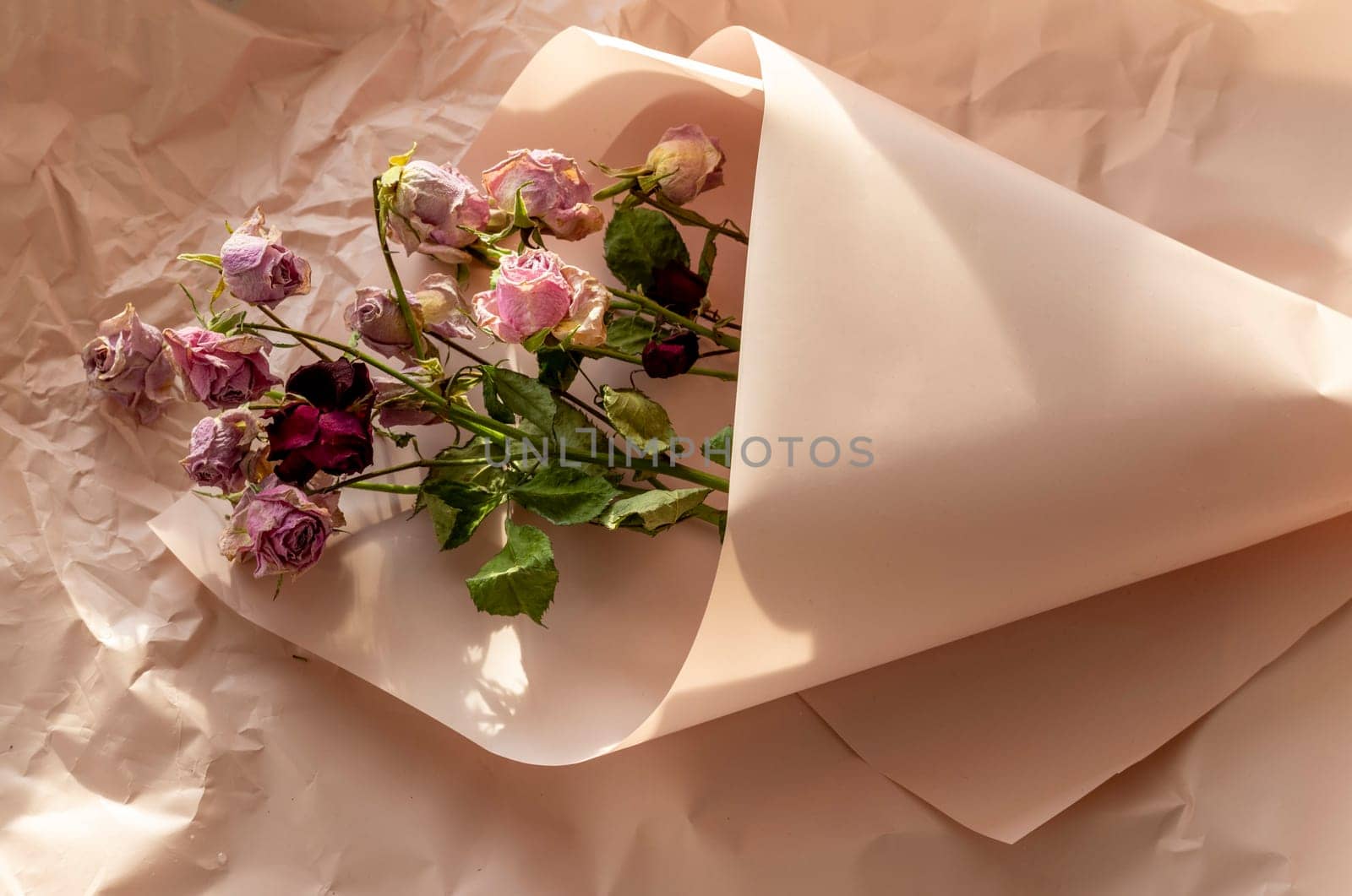Concept shot of the background theme, wrapping paper, dried roses other flowers and other arrangements