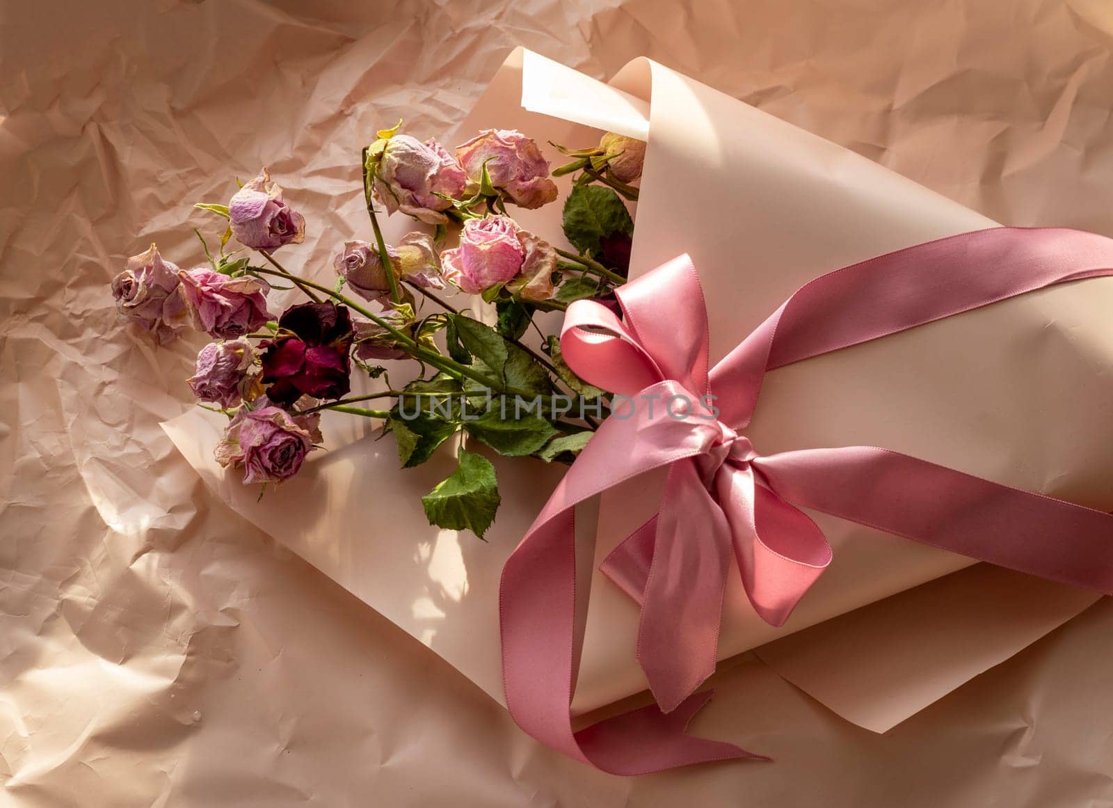 Concept shot of the background theme, wrapping paper, dried roses other flowers and other arrangements
