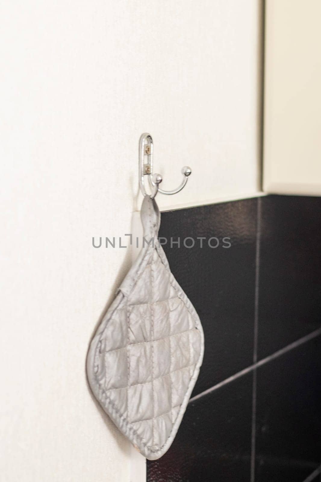 Close up shot of a kitchen grip hanging on the wall