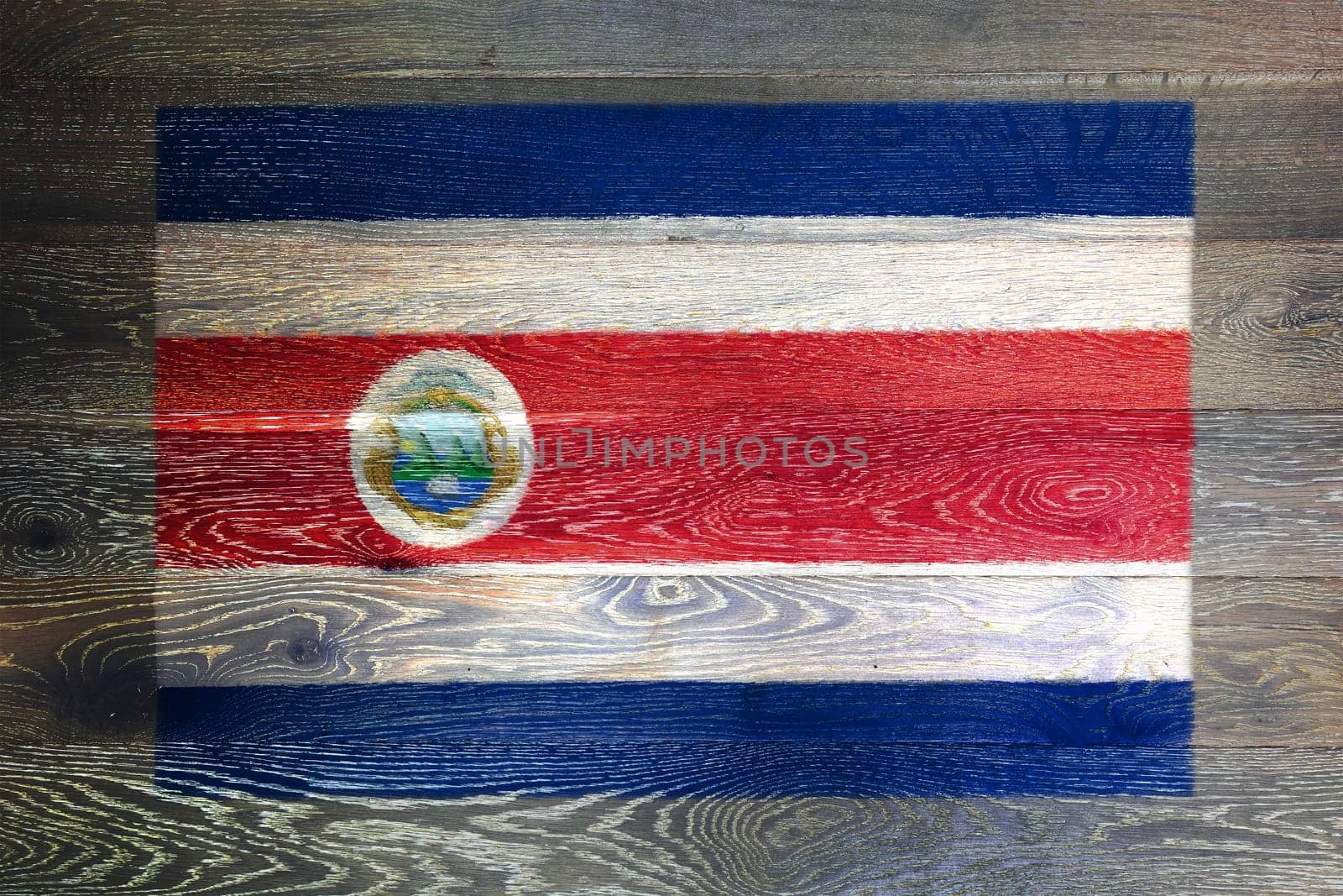 Costa Rica flag on rustic old wood surface background by VivacityImages