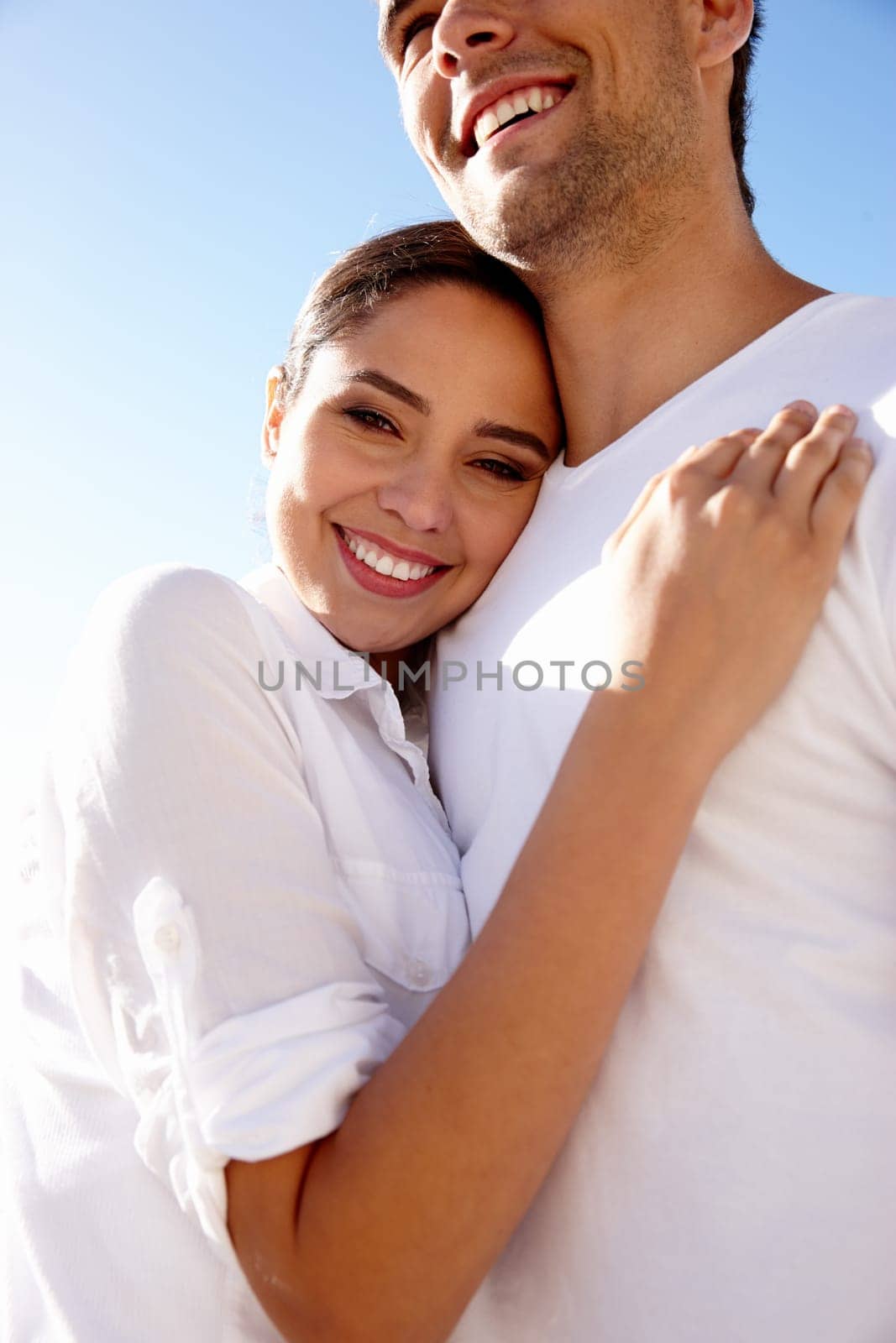 Happy, hug and portrait of couple on beach for bonding, relax together and relationship by ocean. Dating, travel and man and woman embrace for romance on holiday, vacation and weekend in nature by YuriArcurs