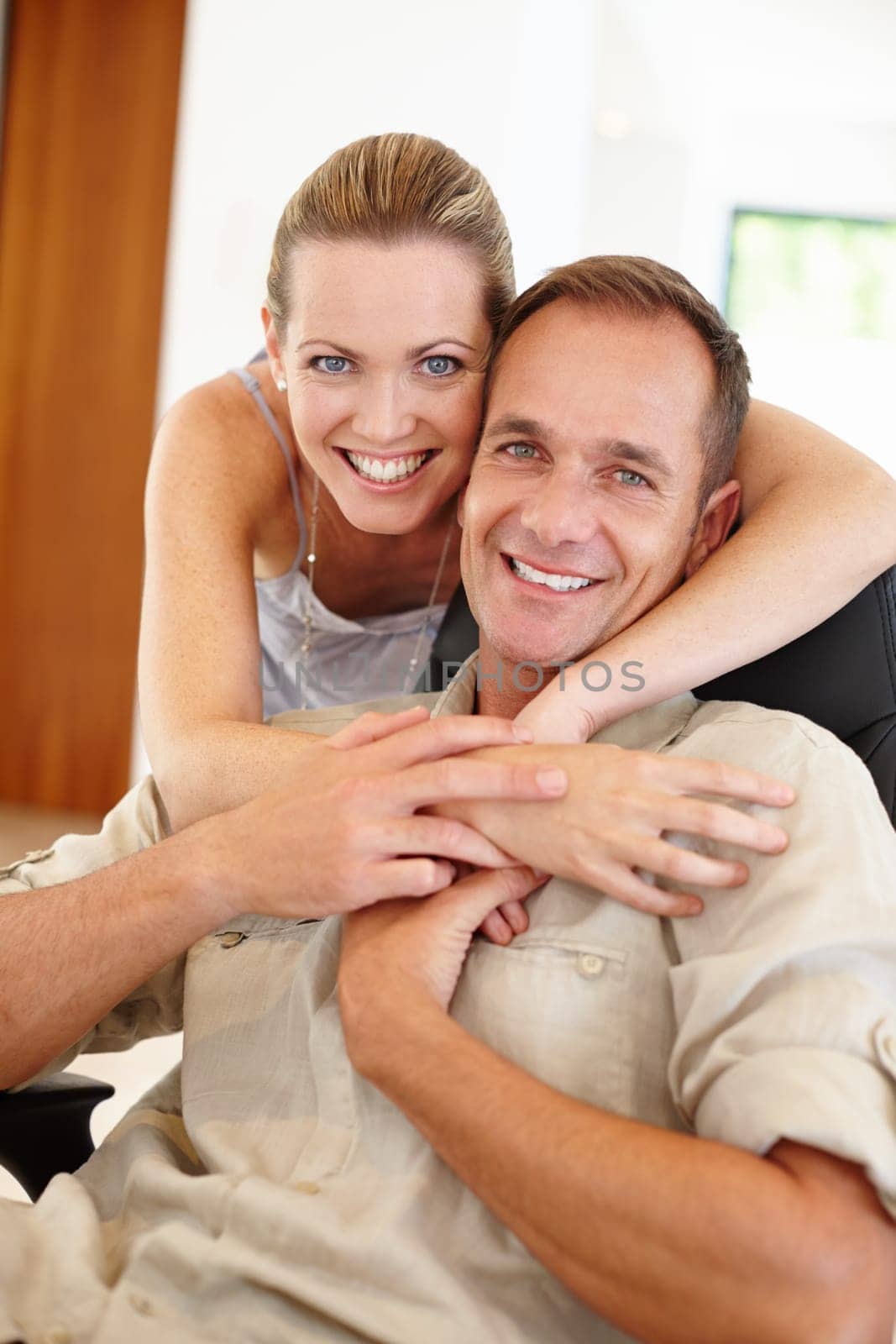 Smile, portrait and couple in embrace for marriage, love and proud of relationship milestone in home. Happy, hugging and people for support or care, romance and bonding in apartment for enjoyment.