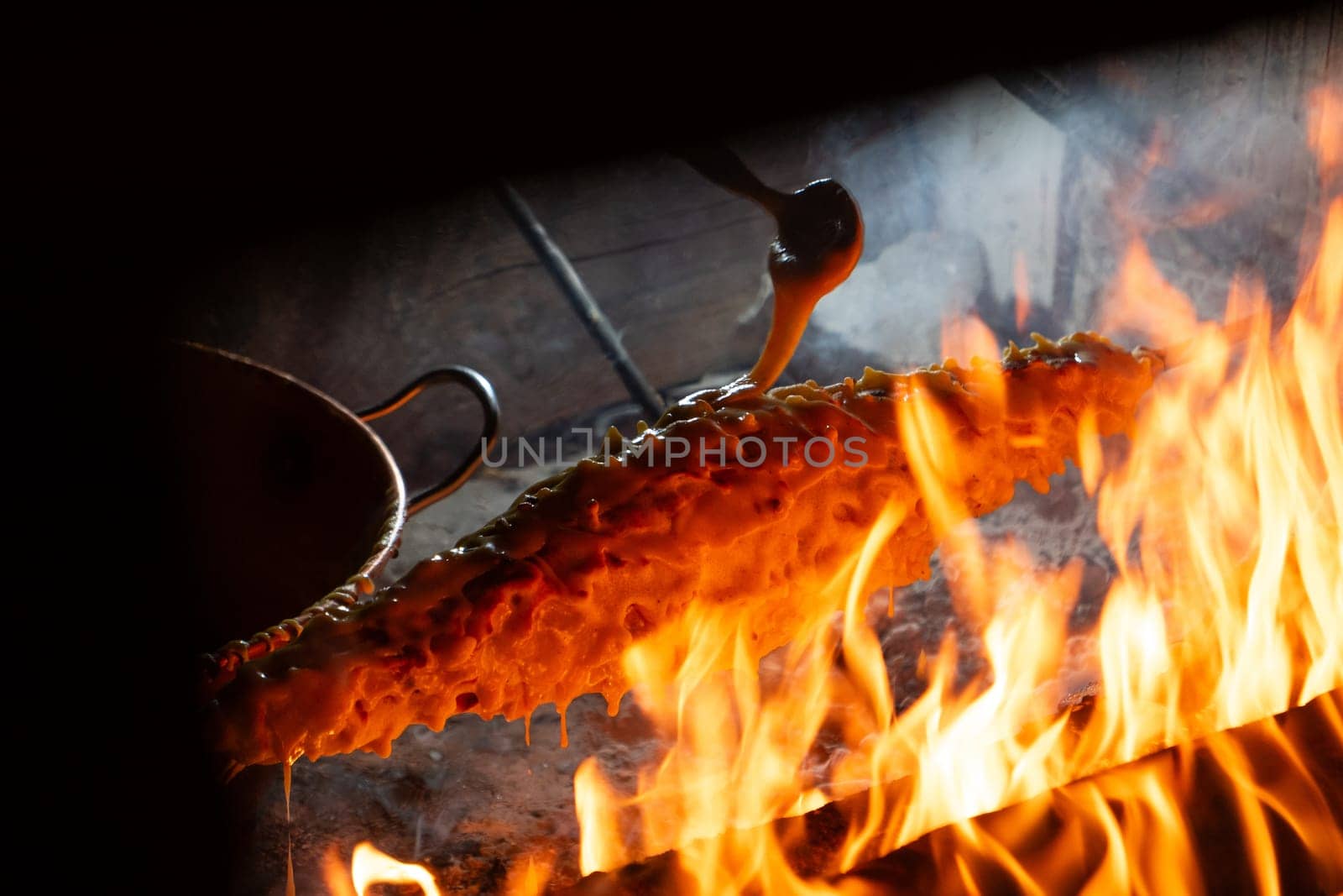 Wood-fired spit-roasted cake, Pyrenees-Atlantique, France. High quality photo