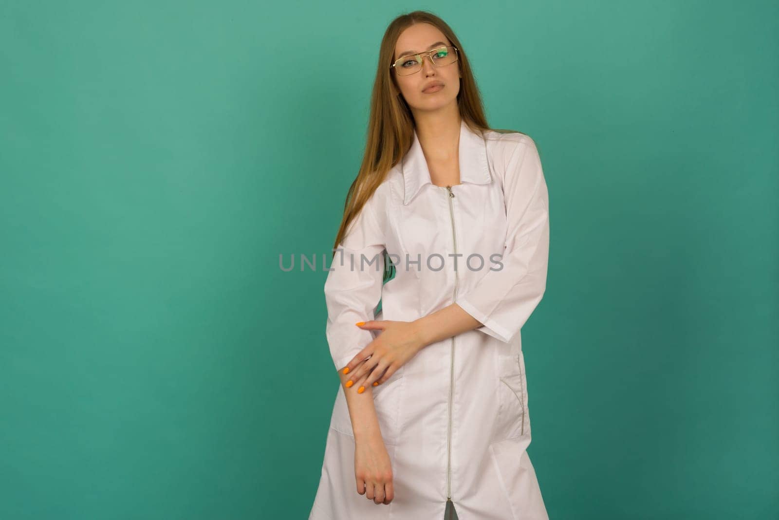 Beautiful smiling sexy nurse or femele doctor standing isjlated on background . Looking at camera. by zartarn