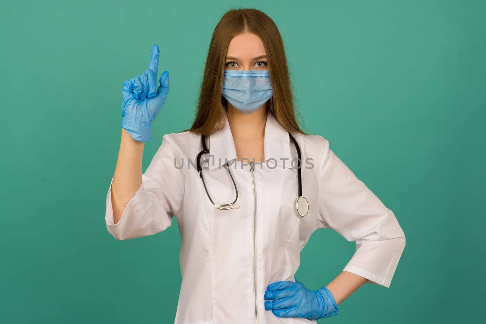 Covid19, coronavirus, healthcare and doctors concept. Portrait of professional confident young caucasian doctor in medical mask and white coat, stethoscope over neck, ready help patient, fight disease - image