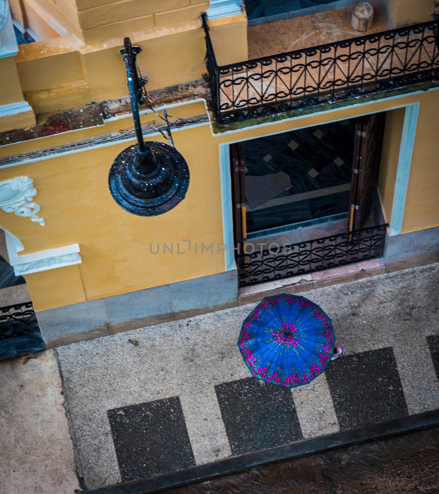 Areal concept shot of the people walking under the rain