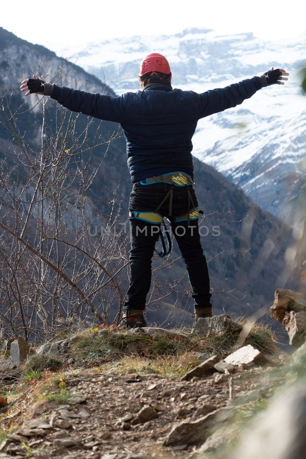 Man in body harnesses feature life-safety, viaferrata in mountains of pyrenees by FreeProd