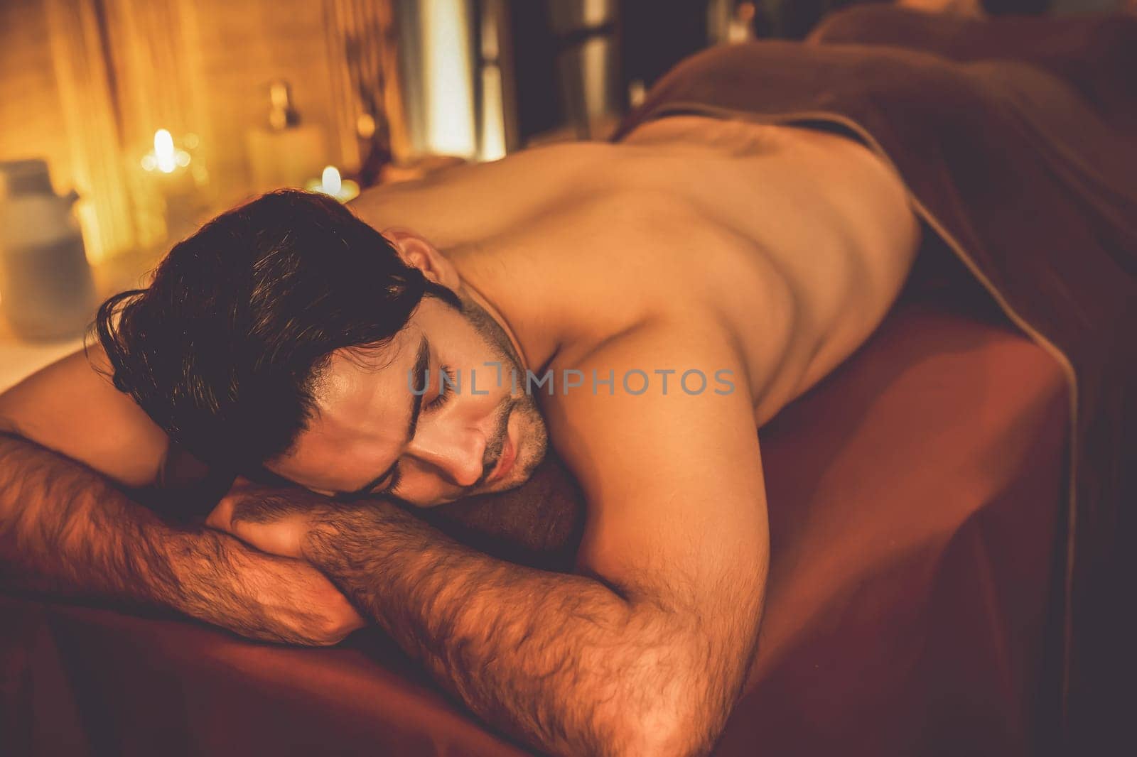 Caucasian man customer enjoying relaxing anti-stress massage. Quiescent by biancoblue