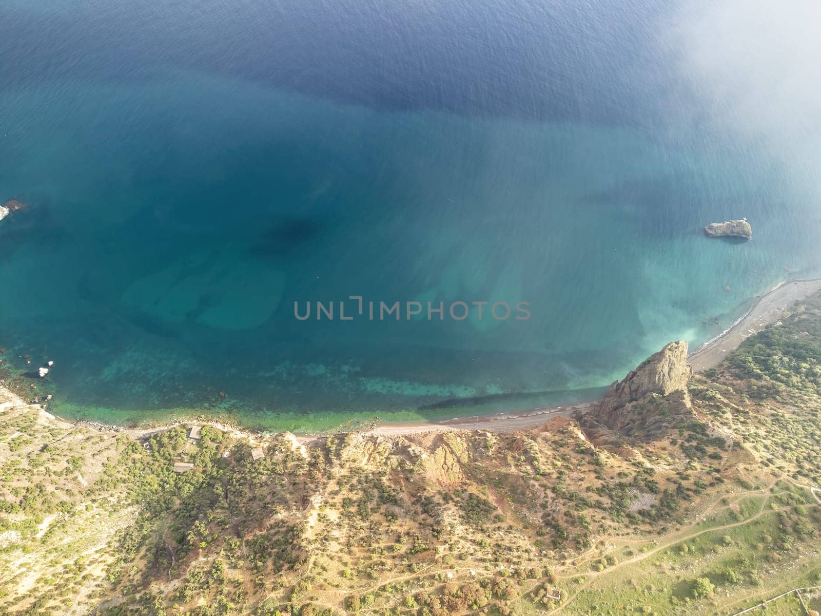 Blue sky with white clouds over calm summer panorama of the sea. Drone aerial view. Abstract aerial nature summer ocean sunset sea and sky background. Horizon. No people. Holiday and vacation concept