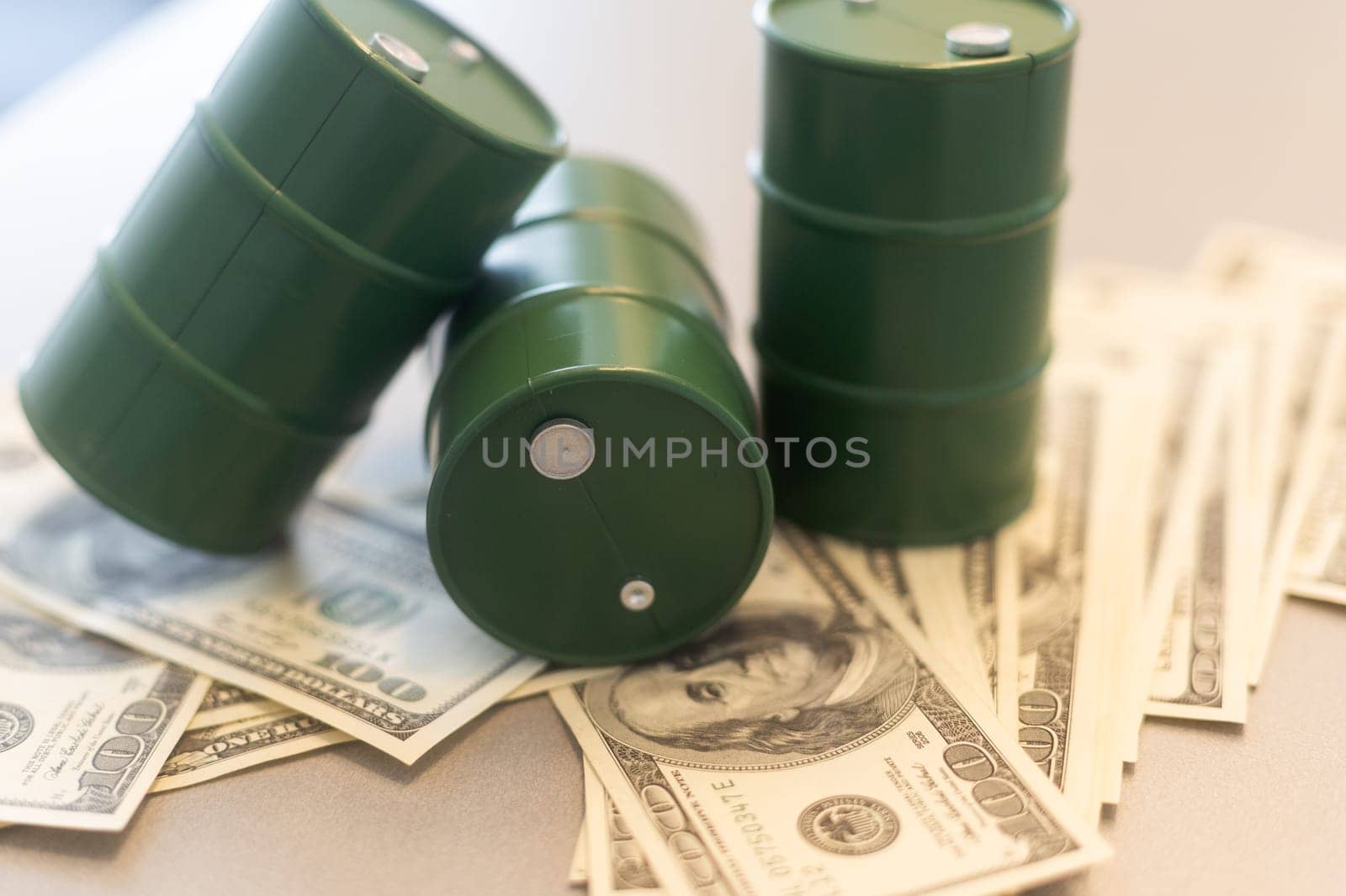 a barrel and dollar bills on a white background. High quality photo