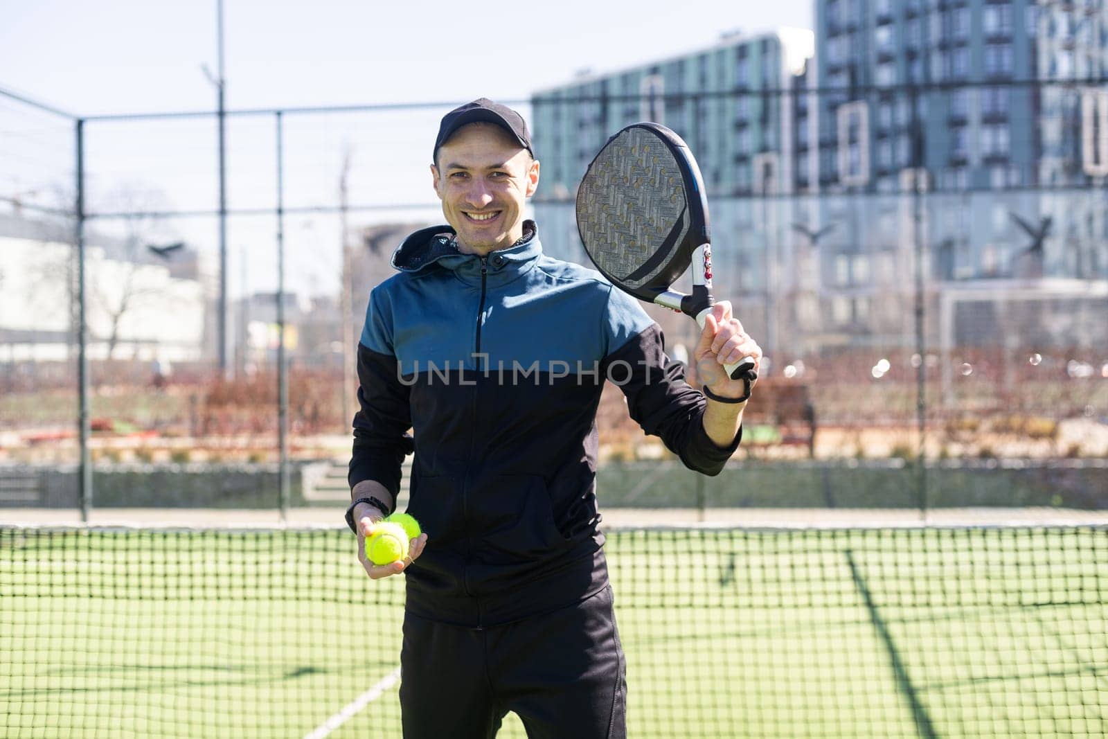 man playing paddle tennis at indoors pitch. High quality photo