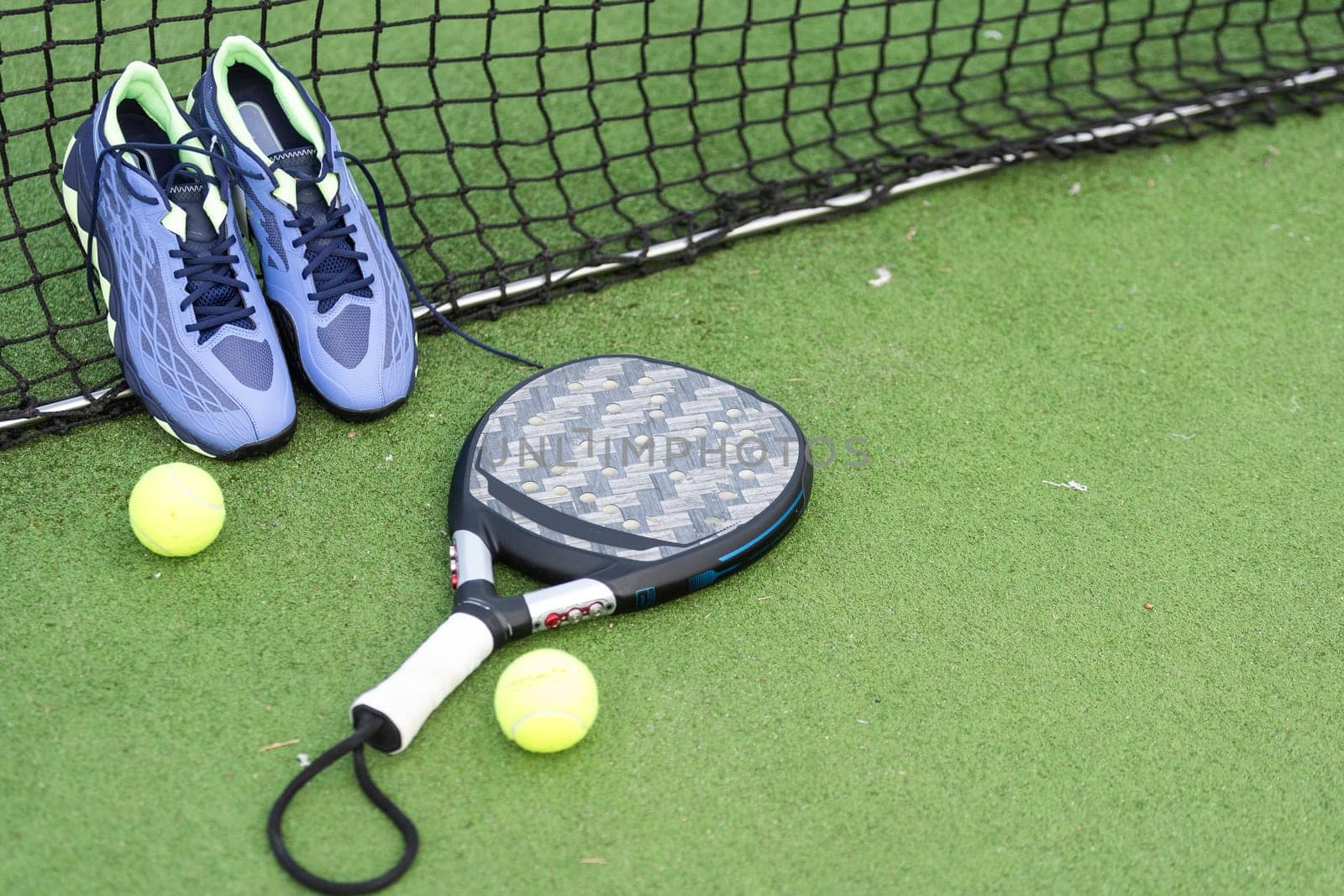Paddle tennis objects and court. High quality photo