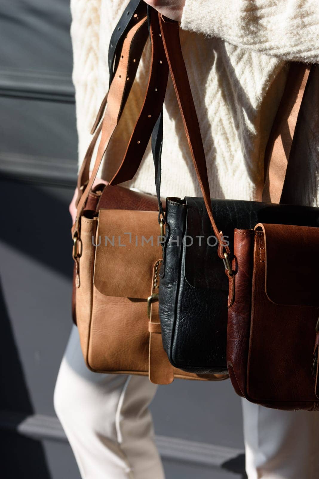 Old vintage colorful leather bags with leather strap. Beautiful small women's leather bags.