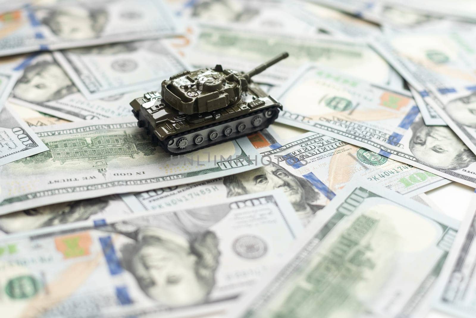 tank against the background of dollars. Concept of war. High quality photo