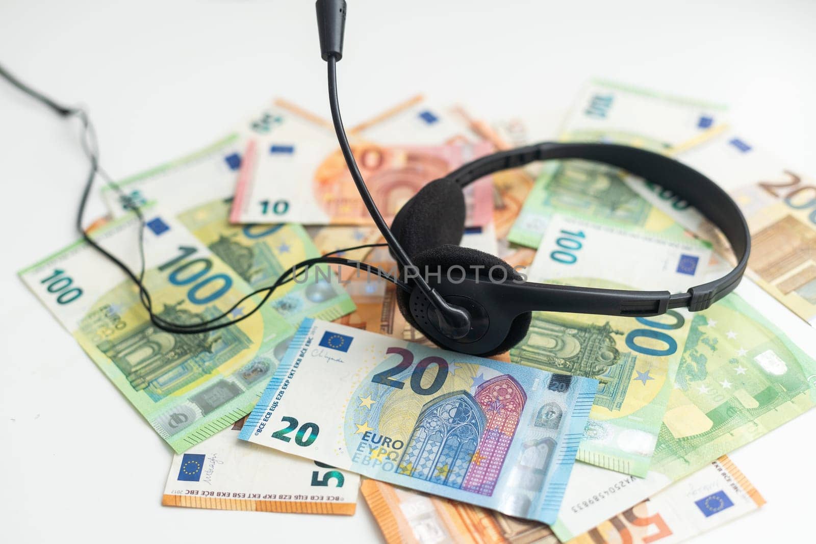 euro banknotes headphones headset. Money and technology still life concept. High quality photo