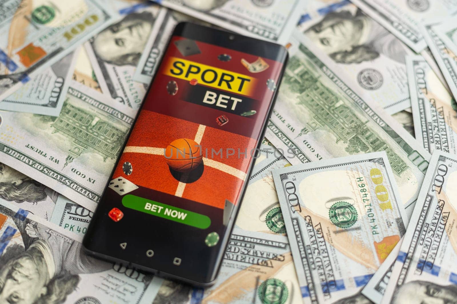 Sports betting website in a mobile phone screen, money by Andelov13