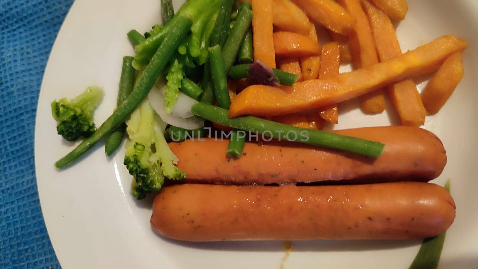 food sausages, sweet potatoes, broccoli. High quality photo