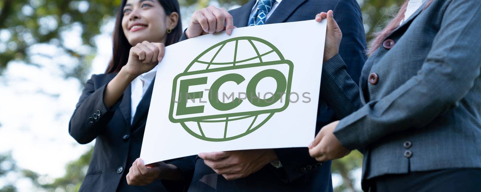 Group of business people stand united, holding eco-friendly idea. Gyre by biancoblue