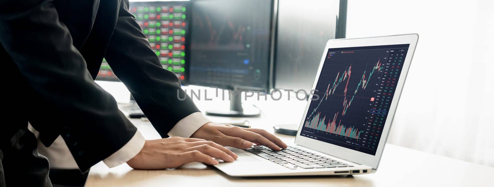 Cropped image of group of expert professional treader discuss about stock market graph show increasing graph while point on the computer display at office. Money exchange, growth chart. Burgeoning.