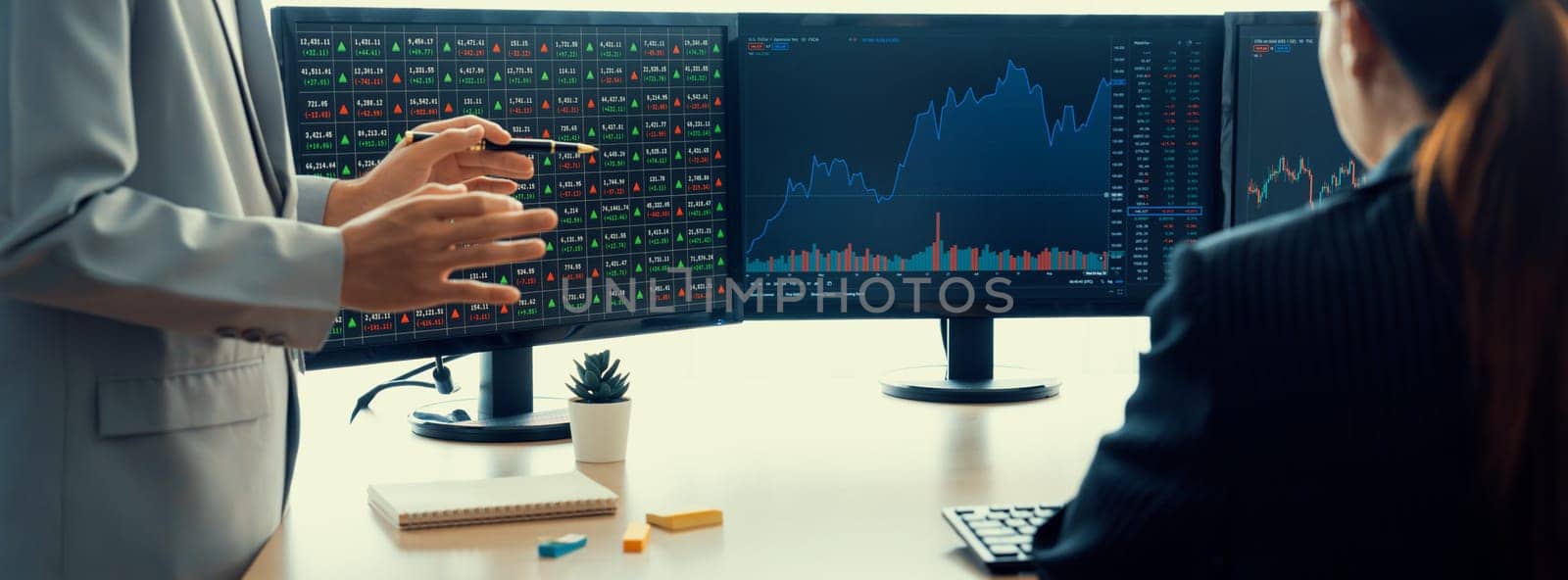 Professional broker present interested stock with growth graph to skilled businesswoman for financial investment. Stock trading. Stock investment. Stock trading market concept. Burgeoning..