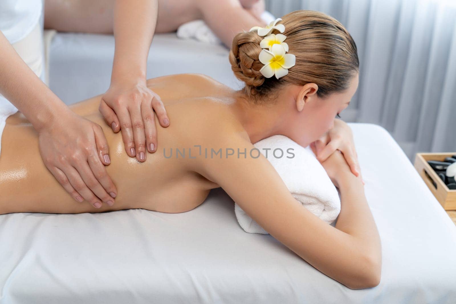 Caucasian couple customer enjoying relaxing anti-stress massage. Quiescent by biancoblue