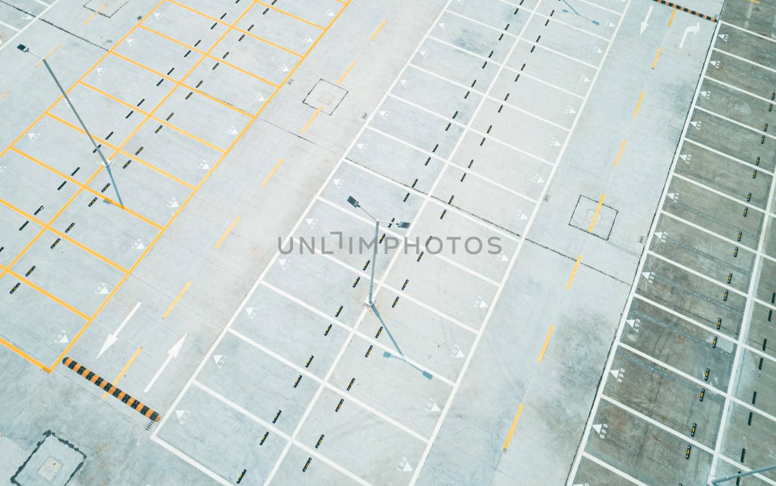Aerial high angle shot of an empty car parking lot
