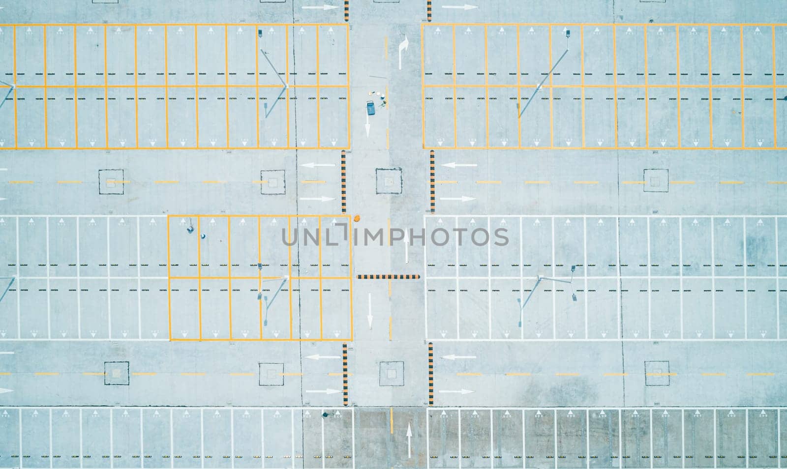 Aerial top down shot of an empty car parking lot by Busker
