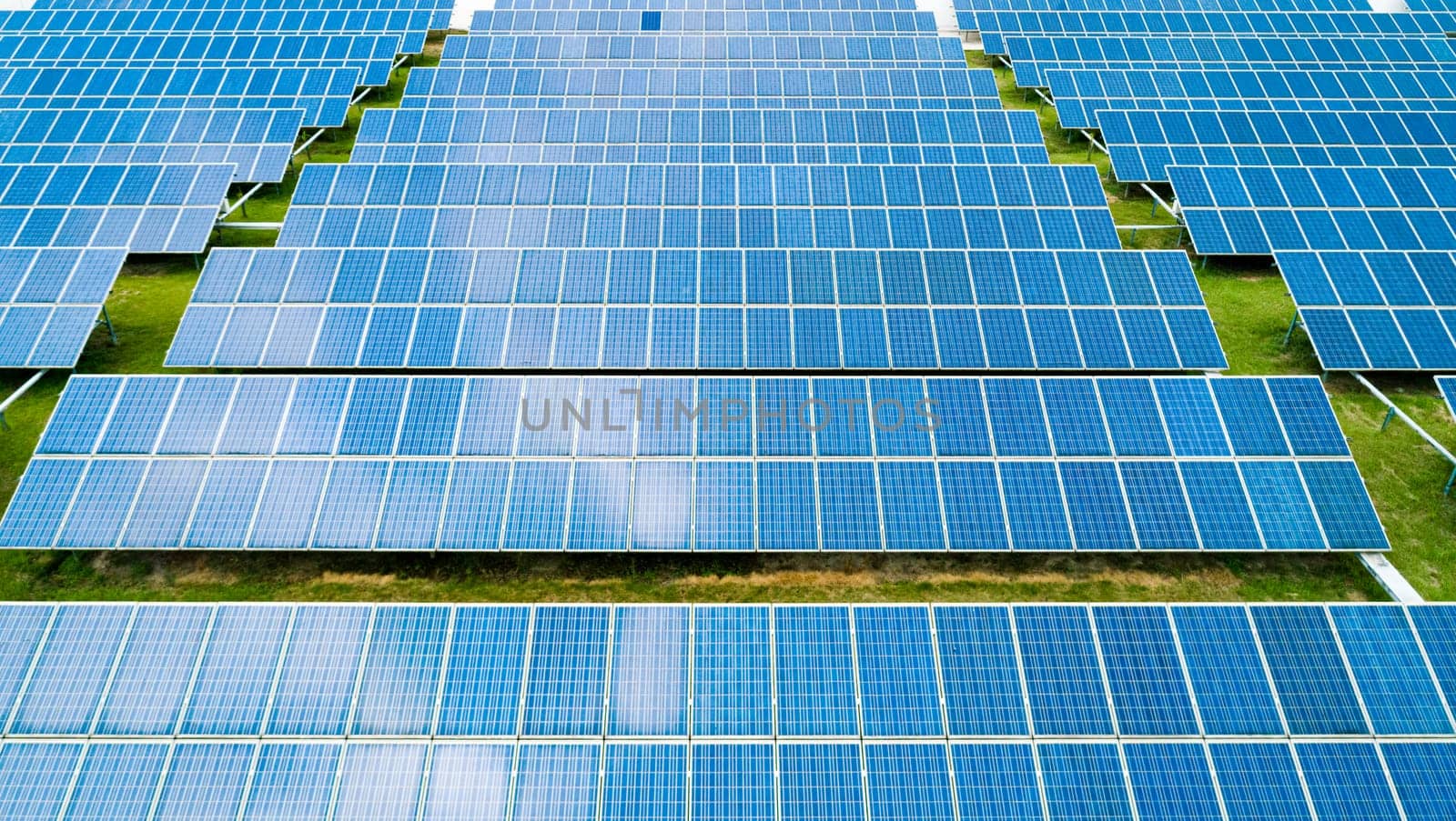 Aerial view of Solar Panels Farm Solar Cell Station. Production of clean energy. Renewable green alternative energy concept.