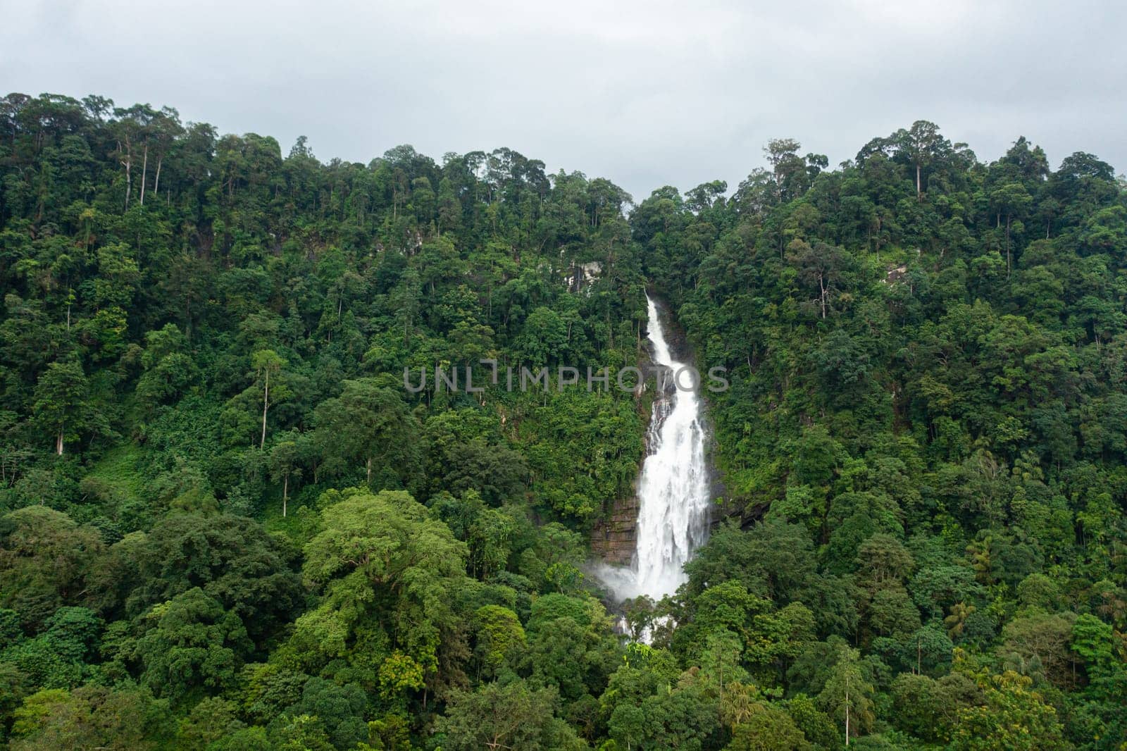 Waterfall in a tropical forest. Aerial view of Mapalana Falls. Sri Lanka.