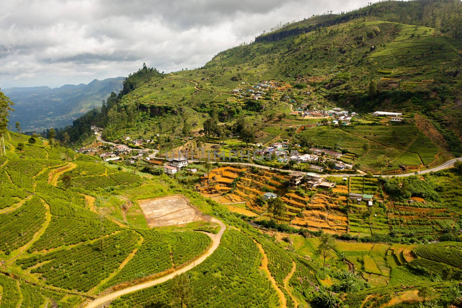 Aerial view of Village of farmers on the mountain slopes among the tea plantations. Nuwara Eliya, Sri Lanka.